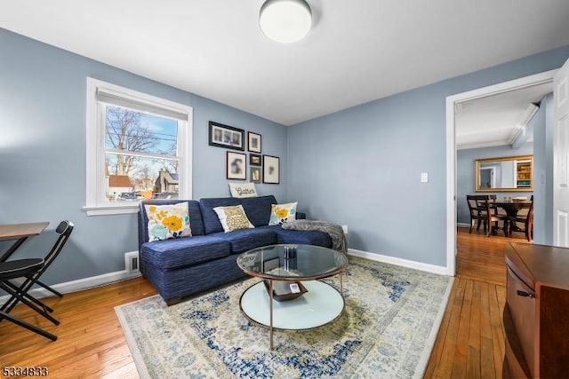 living room with light hardwood / wood-style flooring