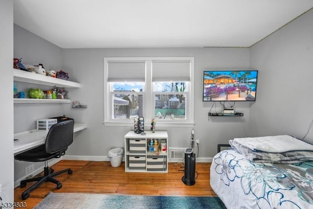 bedroom featuring wood-type flooring