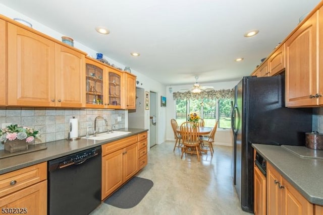 kitchen featuring tasteful backsplash, dishwasher, sink, and ceiling fan