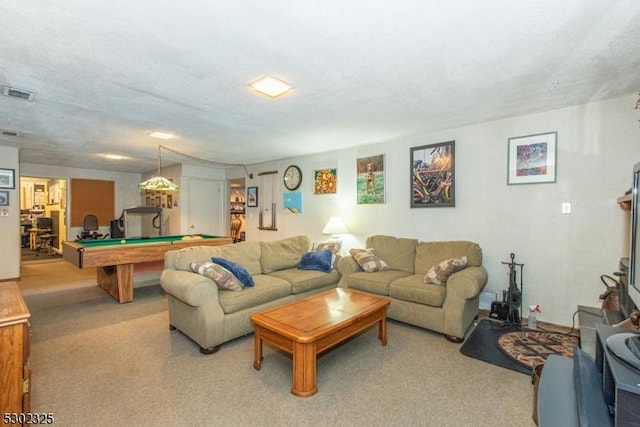 living room featuring light colored carpet, billiards, and a textured ceiling