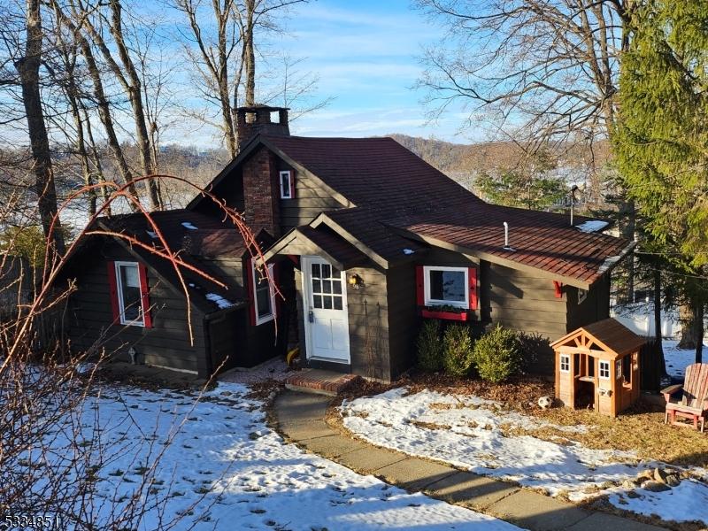 view of front of house with a shed