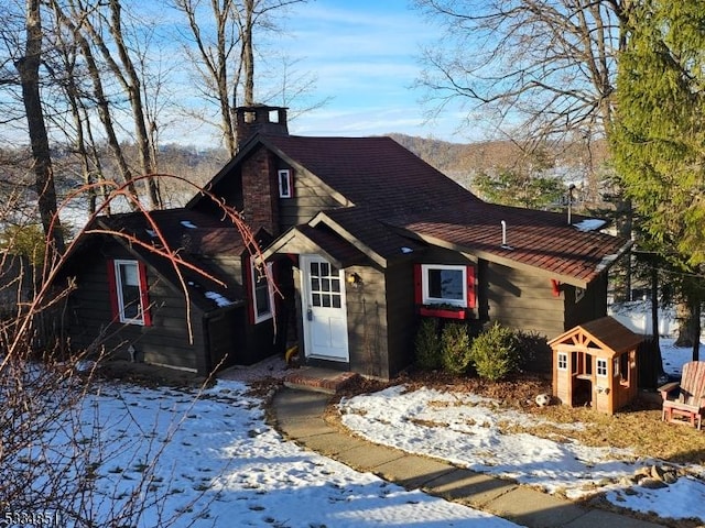 view of front of house with a shed