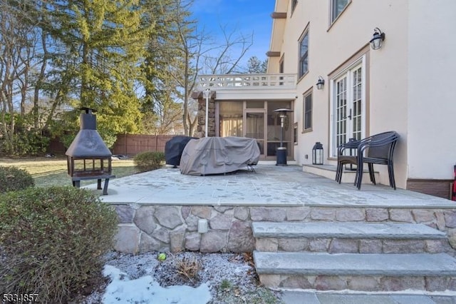 view of patio featuring french doors and fence