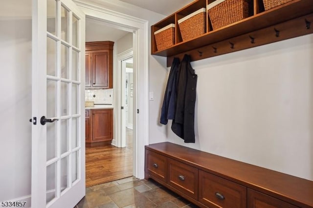 mudroom with stone finish floor