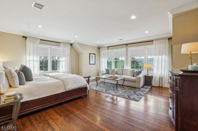 bedroom featuring recessed lighting, visible vents, crown molding, and wood finished floors