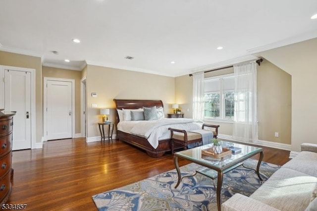 bedroom featuring baseboards, visible vents, wood finished floors, crown molding, and recessed lighting