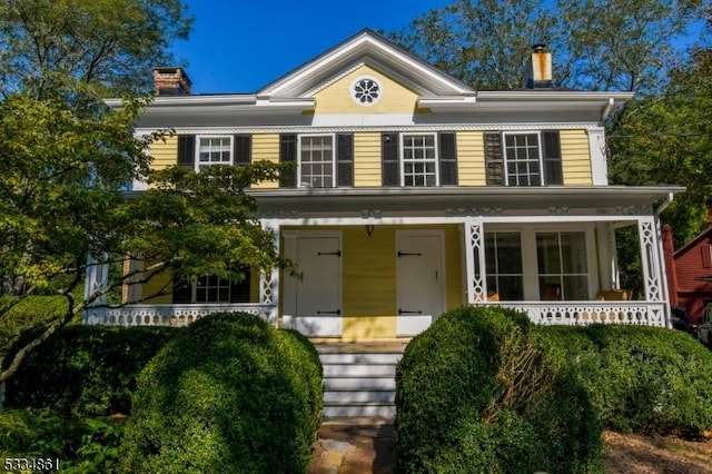 view of front of home featuring a chimney