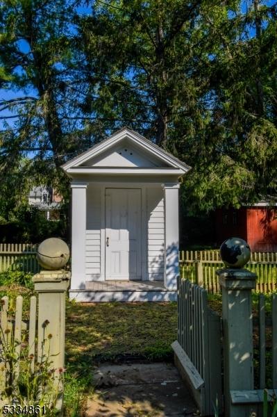 view of shed with fence