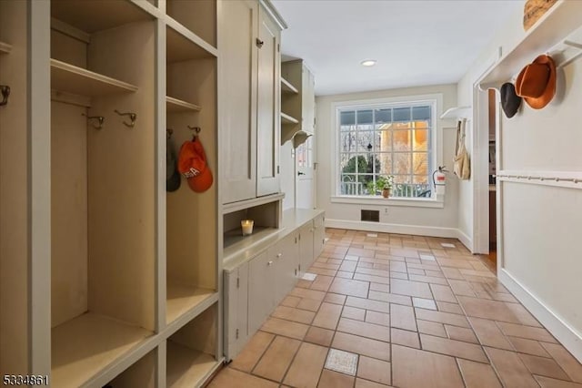 mudroom featuring visible vents, baseboards, and recessed lighting