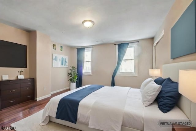 bedroom featuring dark wood-type flooring