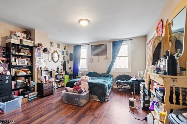 bedroom featuring dark wood-type flooring