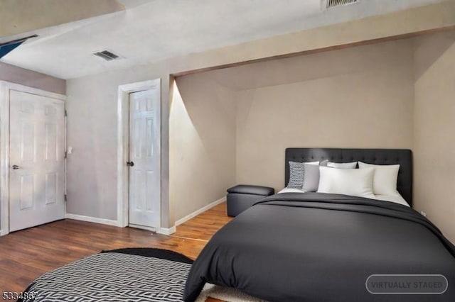 bedroom with hardwood / wood-style floors