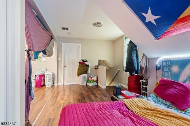 bedroom with hardwood / wood-style flooring