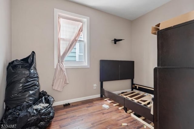 bedroom with wood-type flooring