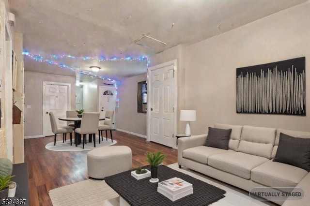 living room with dark hardwood / wood-style flooring