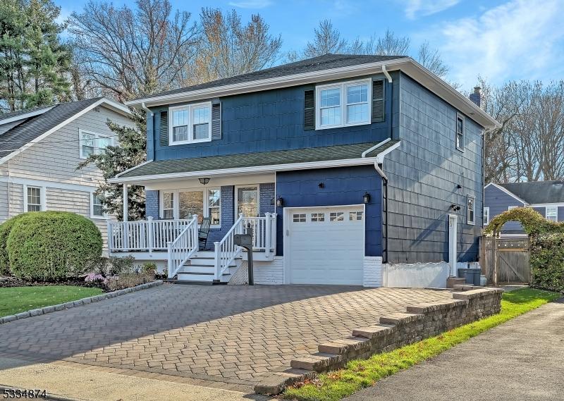 view of front of home featuring a garage and a porch