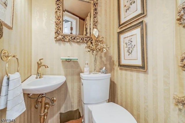 bathroom featuring sink and toilet