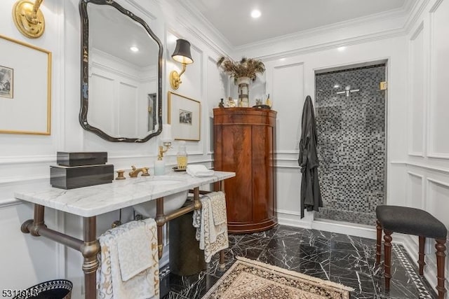 bathroom featuring crown molding, vanity, and a tile shower