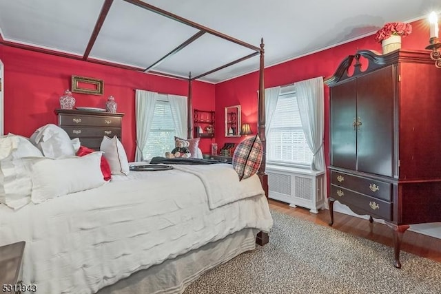 bedroom with hardwood / wood-style flooring