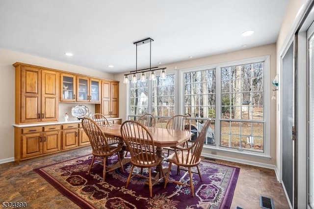 dining room featuring recessed lighting, visible vents, and baseboards