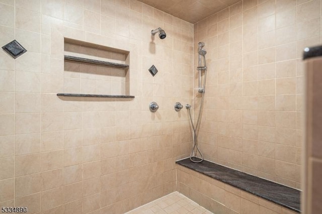 bathroom with a tile shower