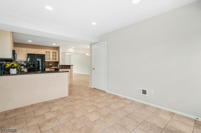 18 Yarmouth Ct, Scotch Plains Twp, NJ 07076 - kitchen featuring black fridge with ice dispenser, dark countertops, tasteful backsplash, recessed lighting, and glass insert cabinets