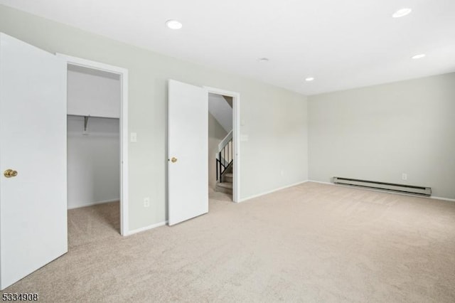 18 Yarmouth Ct, Scotch Plains Twp, NJ 07076 - unfurnished bedroom with baseboard heating, carpet flooring, a walk in closet, recessed lighting, and baseboards