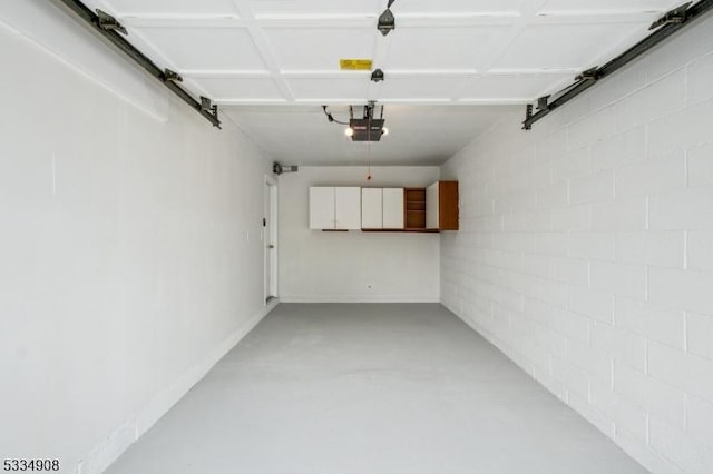 18 Yarmouth Ct, Scotch Plains Twp, NJ 07076 - garage featuring a garage door opener and concrete block wall