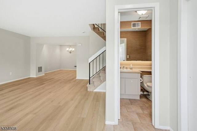 18 Yarmouth Ct, Scotch Plains Twp, NJ 07076 - entrance foyer featuring stairs, a chandelier, baseboards, and light wood-type flooring