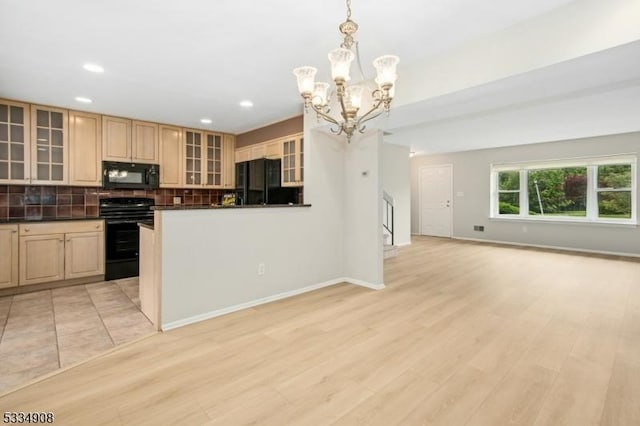 18 Yarmouth Ct, Scotch Plains Twp, NJ 07076 - kitchen featuring black appliances, a chandelier, dark countertops, decorative backsplash, and glass insert cabinets