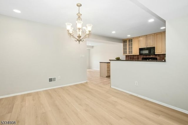 18 Yarmouth Ct, Scotch Plains Twp, NJ 07076 - kitchen with black microwave, recessed lighting, dark countertops, light wood-style flooring, and light brown cabinetry