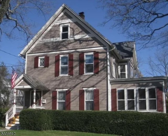 view of front of property with a chimney