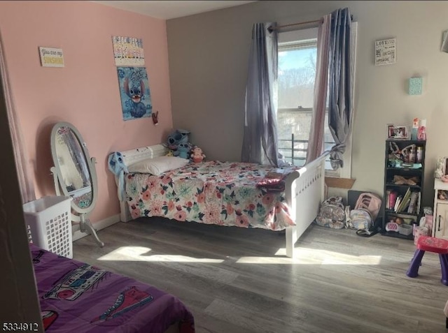 bedroom featuring wood finished floors