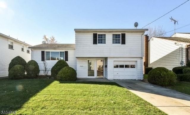 split level home with a garage and a front yard