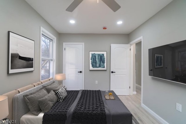 bedroom featuring ceiling fan and light wood-type flooring