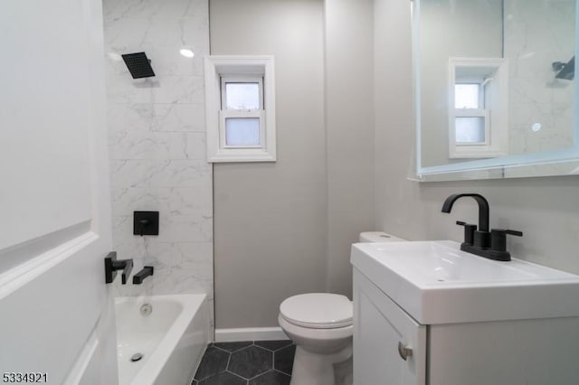 full bathroom with tiled shower / bath combo, vanity, tile patterned floors, and toilet