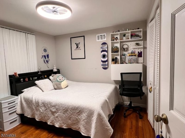 bedroom featuring dark hardwood / wood-style floors