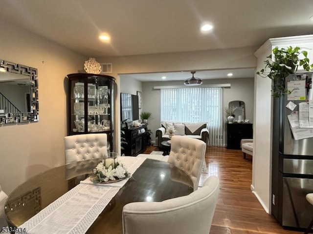 dining area with dark hardwood / wood-style floors