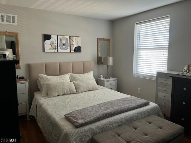 bedroom featuring dark hardwood / wood-style flooring