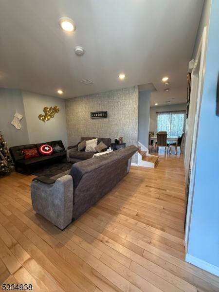 living room with light hardwood / wood-style floors