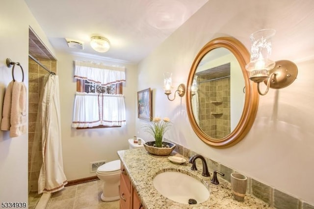 bathroom with tile patterned floors, vanity, toilet, and a shower with shower curtain