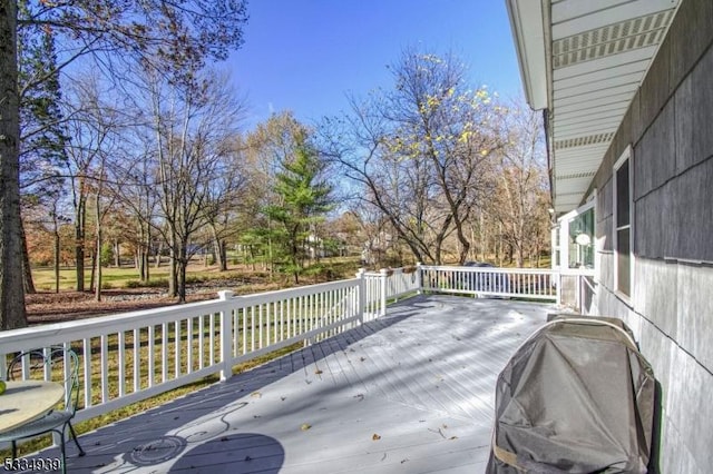 wooden terrace featuring area for grilling