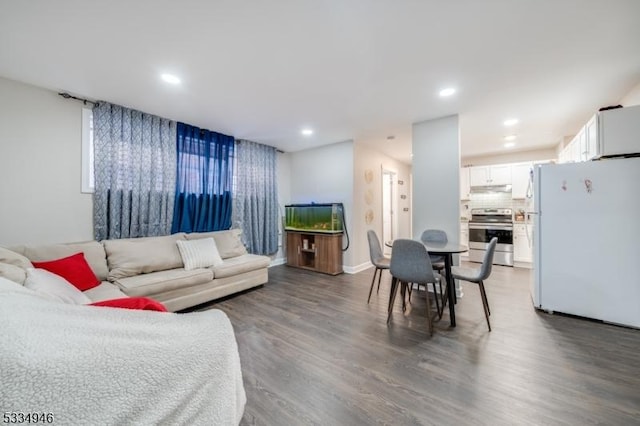 living room with dark hardwood / wood-style floors