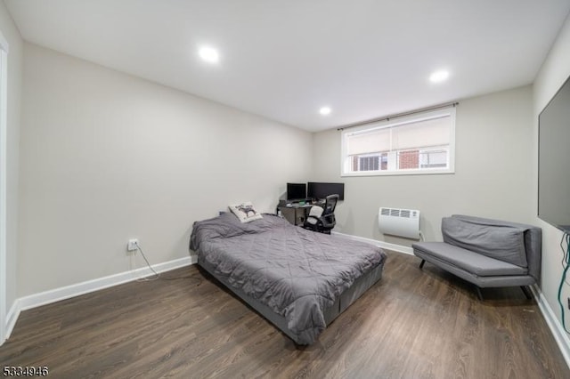 bedroom featuring dark wood-type flooring and heating unit