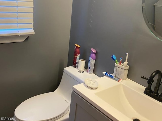 bathroom with vanity and toilet