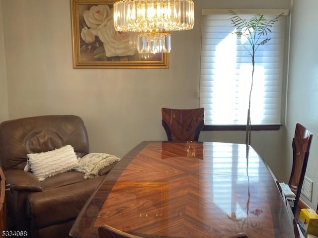 dining area featuring an inviting chandelier