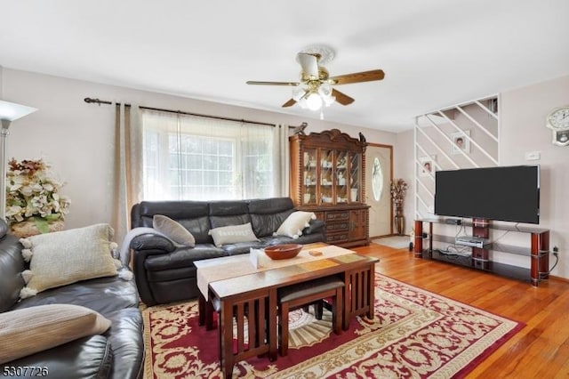 living room with ceiling fan and wood-type flooring