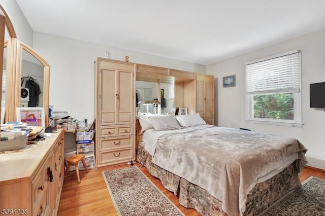 bedroom with light hardwood / wood-style floors