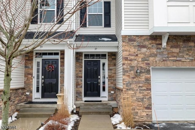 view of exterior entry featuring a garage