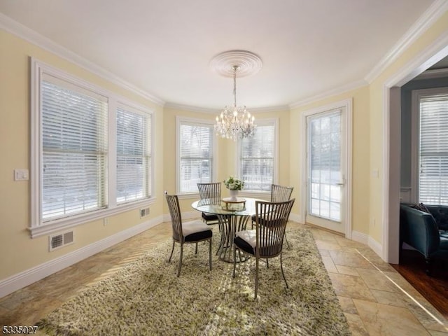 dining space featuring crown molding and a notable chandelier